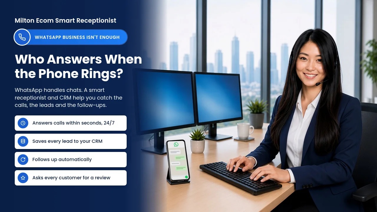 Smiling receptionist wearing a headset at her desk, with a phone showing a WhatsApp chat beside her.